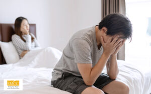 Man hiding face after relationship conflict.