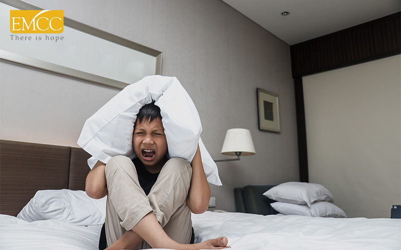 Child overwhelmed by noise, potentially showing trauma response