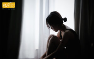 Woman in silhouette suffering from emotional pain or trauma