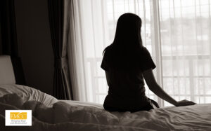 Woman sitting alone, potentially struggling with depression